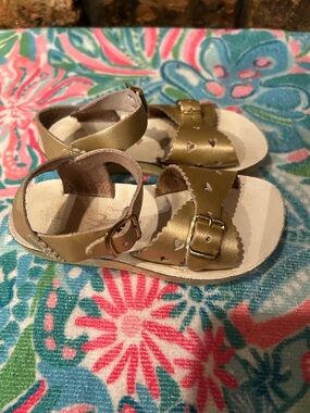 Sun-San gold sandals.